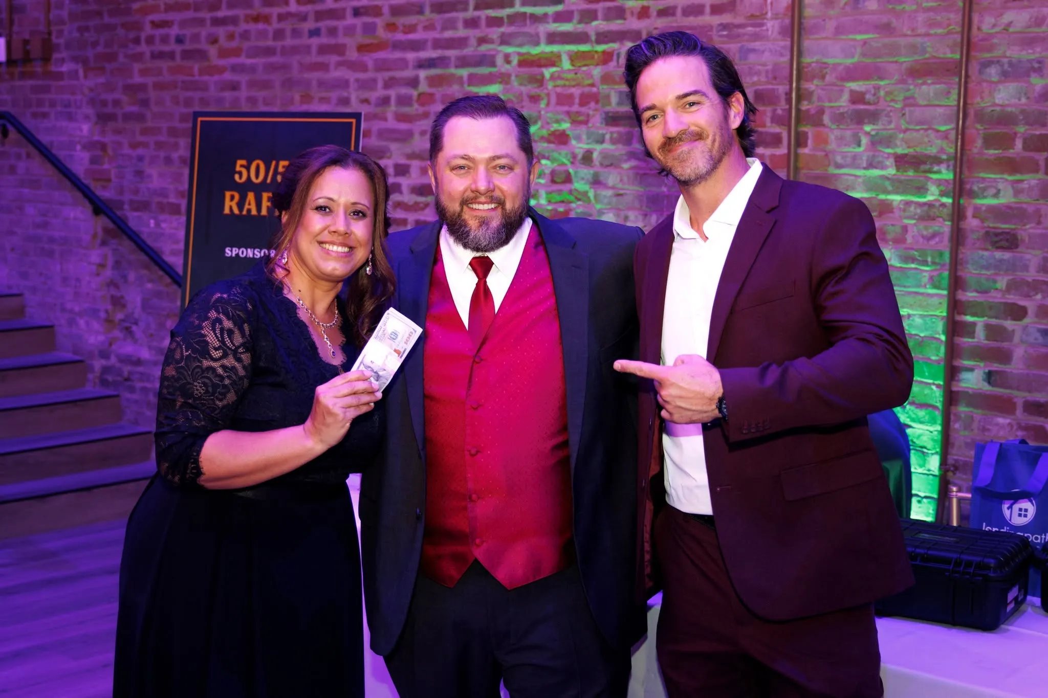 Happy raffle winners showing off their ticket